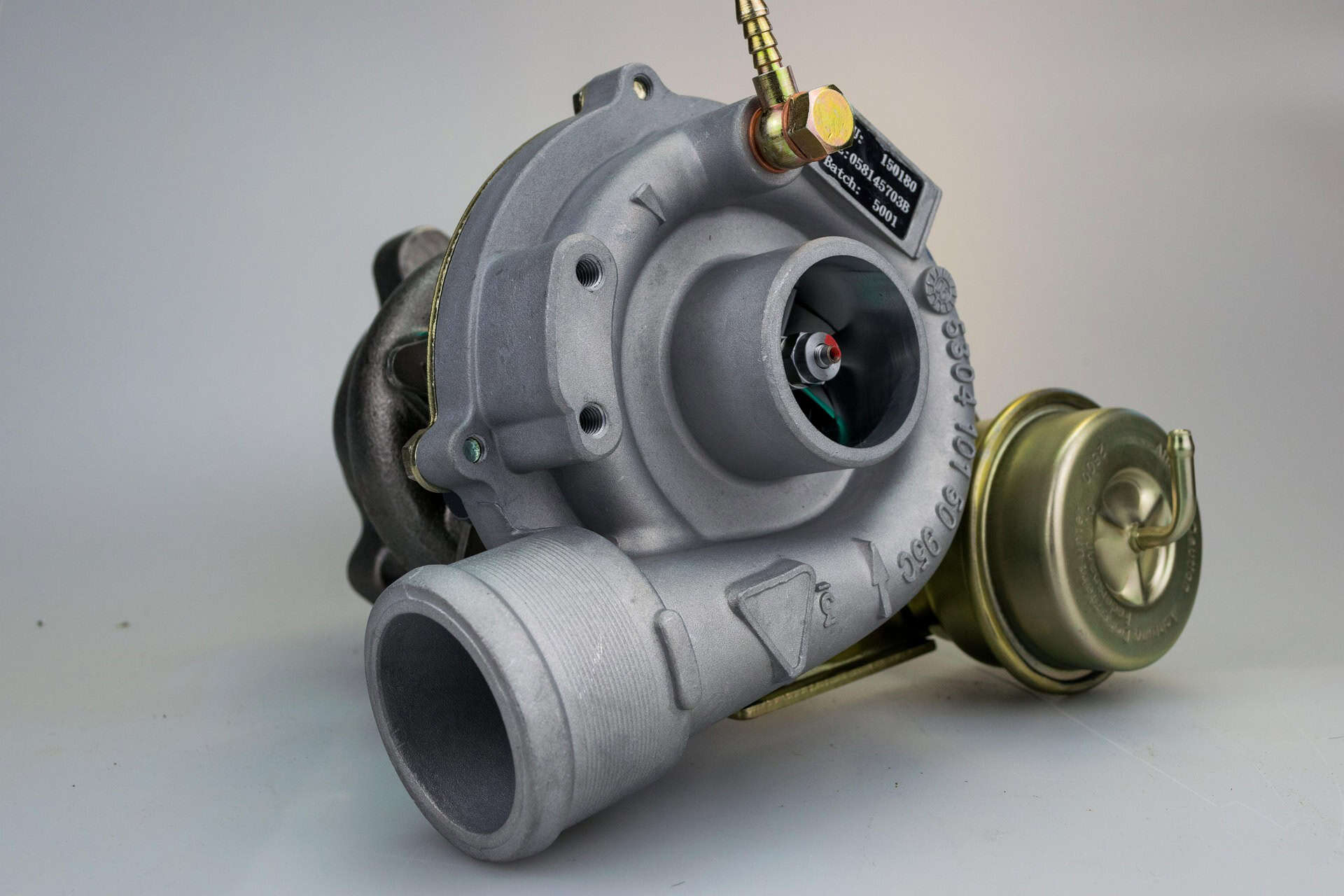 Automotive turbocharger isolated on white background